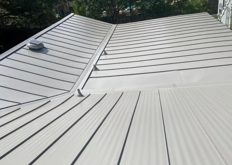 Solar attic fan installed on a metal roof for Roof Ventilation in Old Orchard Beach